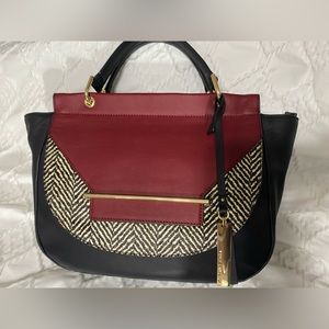Vince Camuto bag. Black with red and black and white wool pattern